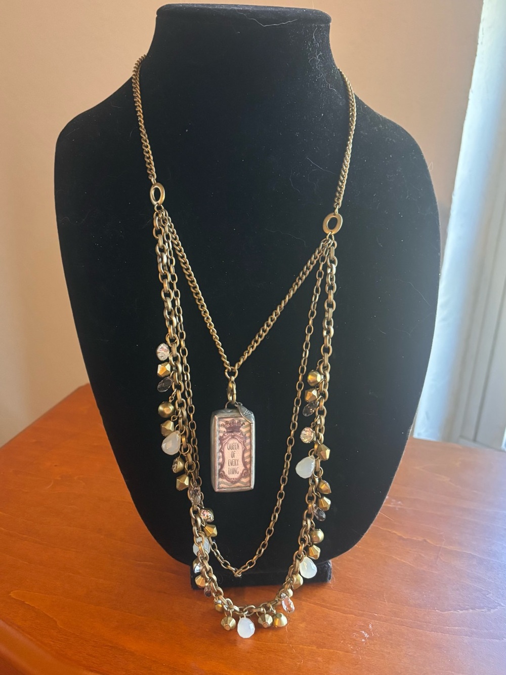 Jewel Kade antique brass Layered Charm Necklace with White Accents and charm